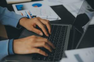 Financial Business team present. Business man hands hold documents with financial statistic stock photo, discussion, and analysis report data the charts and graphs. Finance Financial concept photo