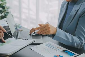 Financial Business team present. Business man hands hold documents with financial statistic stock photo, discussion, and analysis report data the charts and graphs. Finance Financial concept photo