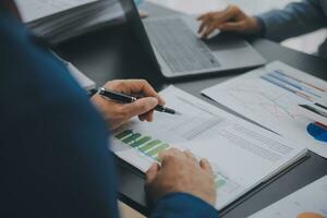 Financial Business team present. Business man hands hold documents with financial statistic stock photo, discussion, and analysis report data the charts and graphs. Finance Financial concept photo