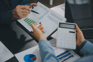 Financial Business team present. Business man hands hold documents with financial statistic stock photo, discussion, and analysis report data the charts and graphs. Finance Financial concept photo