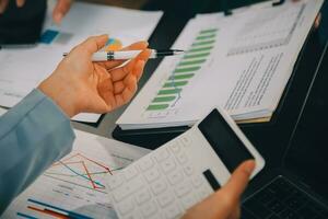 Financial Business team present. Business man hands hold documents with financial statistic stock photo, discussion, and analysis report data the charts and graphs. Finance Financial concept photo