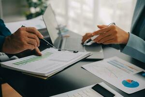 Financial Business team present. Business man hands hold documents with financial statistic stock photo, discussion, and analysis report data the charts and graphs. Finance Financial concept photo