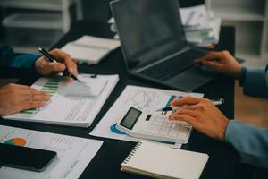 Financial Business team present. Business man hands hold documents with financial statistic stock photo, discussion, and analysis report data the charts and graphs. Finance Financial concept photo