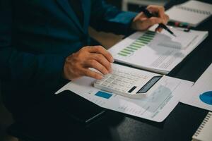 Financial Business team present. Business man hands hold documents with financial statistic stock photo, discussion, and analysis report data the charts and graphs. Finance Financial concept photo