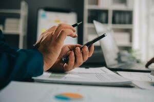 Financial Business team present. Business man hands hold documents with financial statistic stock photo, discussion, and analysis report data the charts and graphs. Finance Financial concept photo