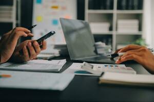 Financial Business team present. Business man hands hold documents with financial statistic stock photo, discussion, and analysis report data the charts and graphs. Finance Financial concept photo