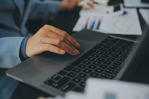 Financial Business team present. Business man hands hold documents with financial statistic stock photo, discussion, and analysis report data the charts and graphs. Finance Financial concept photo