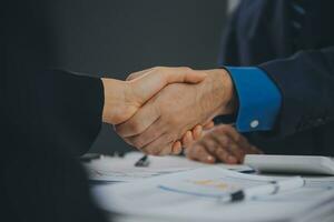 Business handshake for teamwork of business merger and acquisition,successful negotiate,hand shake,two businessman shake hand with partner to celebration partnership and business deal concept photo