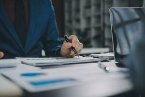 Financial Business team present. Business man hands hold documents with financial statistic stock photo, discussion, and analysis report data the charts and graphs. Finance Financial concept photo