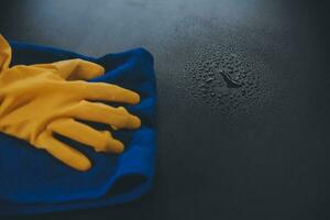 Office Cleaning Service. Janitor Spraying Desk. Workplace Hygiene photo