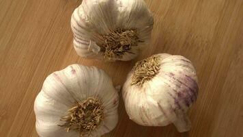 Garlic in Wooden Background rotates video