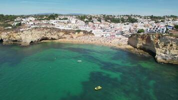 Waves crashing into sandstone cliffs in Carvoeiro, Algarve, Portugal video