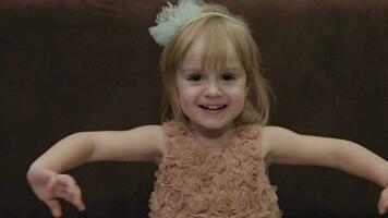 Happy three years old girl. Cute blonde child. Brown eyes. Cute girl smiling video