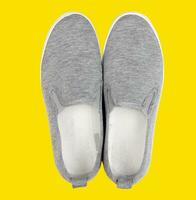 Casual shoes on yellow background photo