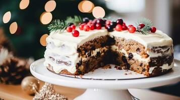 AI generated Christmas cake, holiday recipe and home baking, pudding with creamy icing for cosy winter holidays tea in the English country cottage, homemade food and cooking photo