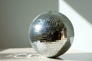 AI generated Silver Disco ball on light background with copy space. Can be used in presentations, articles, or websites related to music, parties, or events photo