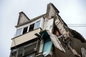 destroyed and burned houses in the city during the war in Ukraine photo