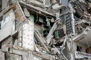 destroyed and burned houses in the city during the war in Ukraine photo