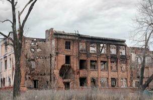 destroyed and burned houses in the city Russia Ukraine war photo