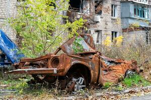 damaged and looted cars in a city in Ukraine during the war photo