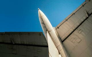 wings of a large soviet airliner against a blue sky photo