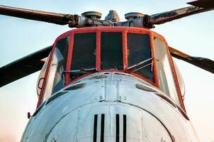 cockpit of an old vintage helicopter with blades photo