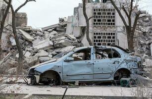 damaged and looted cars in a city in Ukraine during the war photo