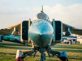 old army military combat fighter aircraft at the airport photo