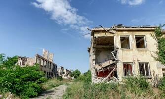 destroyed and burned houses in the city Russia Ukraine war photo