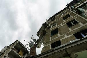 destroyed and burned houses in the city Russia Ukraine war photo