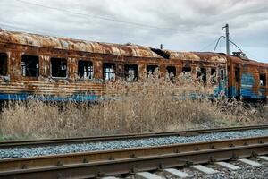 burned out blown up wagons in Ukraine photo