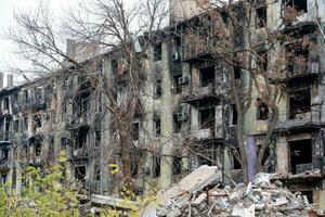 destroyed and burned houses in the city Russia Ukraine war photo