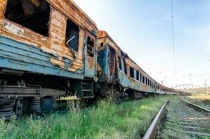 burned out blown up wagons war between Russia and Ukraine photo