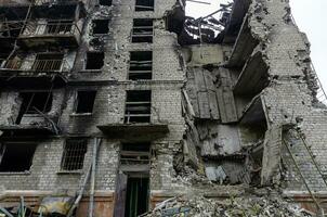 destroyed and burned houses in the city Russia Ukraine war photo