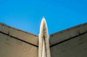 fragment of airplane wings on a background of blue sky photo