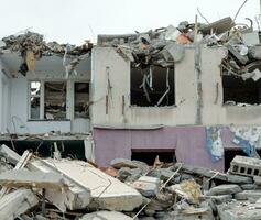 destroyed and burned houses in the city Russia Ukraine war photo