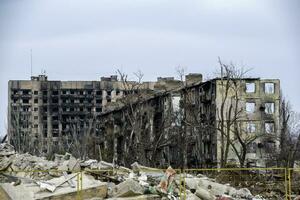 destroyed and burned houses in the city Russia Ukraine war photo