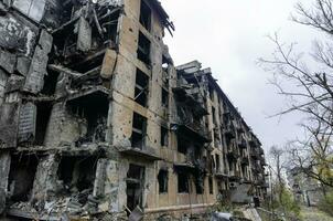 destroyed and burned houses in the city Russia Ukraine war photo