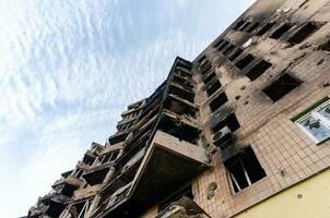 destroyed and burned houses in the city Russia Ukraine war photo