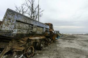 burnt cars and destroyed buildings of the workshop of the Azovstal plant in Mariupol photo