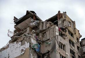 destroyed and burned houses in the city during the war in Ukraine photo