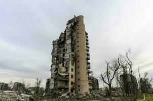 destroyed and burned houses in the city Russia Ukraine war photo