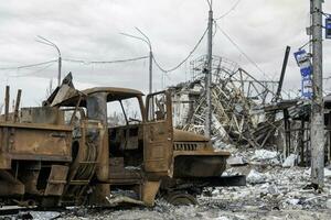 burnt cars and destroyed buildings of the workshop of the Azovstal plant in Mariupol photo