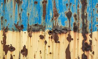 damaged blue yellow house wall war in Ukraine photo