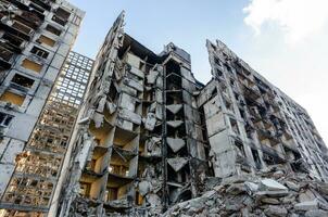 destroyed and burned houses in the city Russia Ukraine war photo