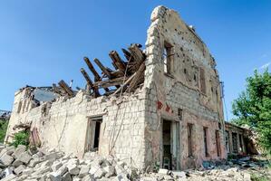 destroyed and burned houses in the city Russia Ukraine war photo