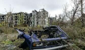 damaged and looted cars in a city in Ukraine during the war photo