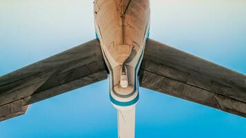 tail and wings of a large old airliner photo