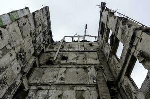 destroyed and burned houses in the city Russia Ukraine war photo