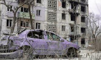 damaged and looted cars in a city in Ukraine during the war photo